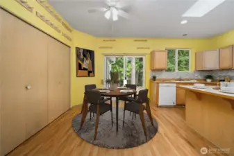Virtually staged eat-in area of kitchen.