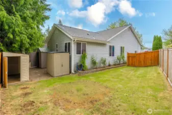 Three storage sheds stay with the property!