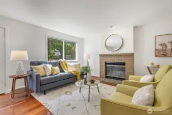 Wonderful great room with wood-burning fireplace, French doors, smart layout, and dining room area!