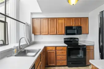 Sleek, black appliances in the kitchen.