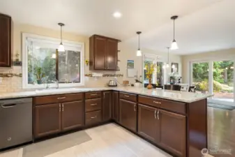 Kitchen With Eating Bar Leading into Family Room
