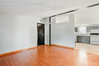 front living room, door leads to primary bedroom