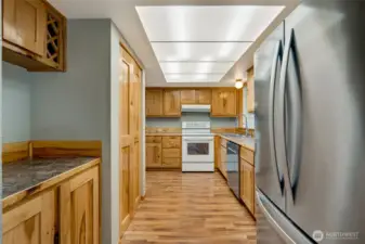 Kitchen with hickory cabinets and custom wine rack