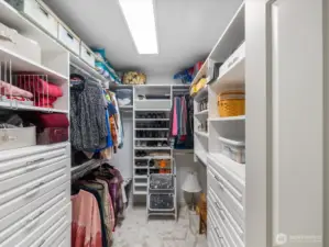 Primary bedroom walk in closet