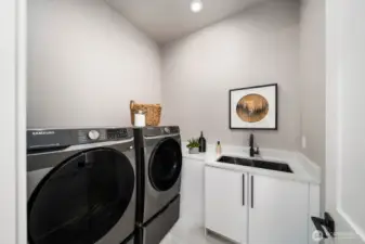 Laundry room with utility sink.