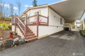 Attached carport with easy access into the utility room.