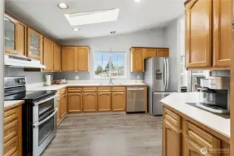 Great size kitchen with a skylight, lots of counter space to enjoy the everyday cooking tasks and extra cabinetry.