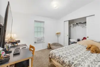 Guest bedroom with vaulted ceilings.