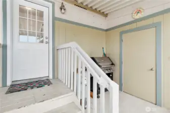 Storage shed located in the carport with electricity.