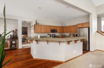 Kitchen with bar is ready for your culinary creativity.