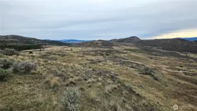 Shot from the center-west end. Ideal orientation for a sun-drenched breakfast nook. Power at the street; minutes to Tonasket/Oroville. Bring your ideas!