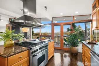 Six-burner Dacor gas range, commercial hood, and granite countertops...