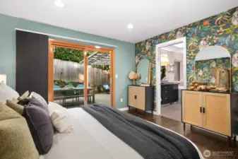 ...with glass doors that flow to the private grounds; and ensuite bath beyond...