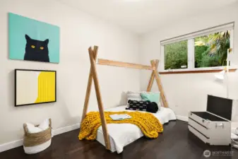 ...and the third bedroom on the main level, with windows to the backyard.