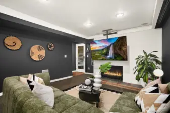 Downstairs to the lower level entertainment room with big-screen TV and surround sound for movie nights...