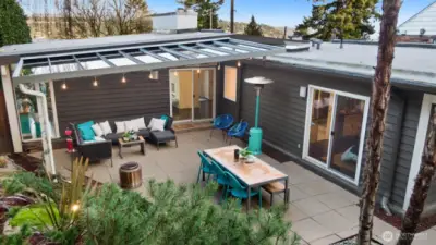 Outdoor entertainment patio connects to both the living room and primary suite.
