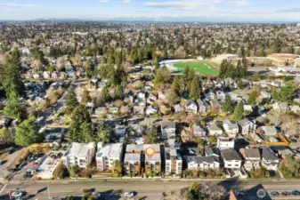 Aerial photo looking west. From this photo you can see Roosevelt High School playfield and Green Lake. Sought after Wedgwood neighborhood 86 walk score & 81 bike score. Walking distance to grocery stores, cafes, and only minutes to Children's, UW, 520, downtown & Amazon! Located in #1 sought after school cluster!