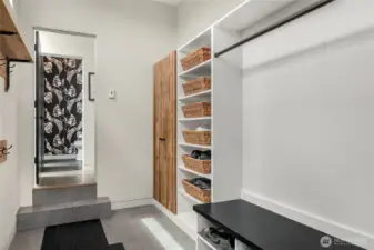 Mud room opens to the outside in the back of the home and enters into the back hall.  Lots of room for jackets, shoes and whatever else you need to store!  Across the hall is the powder room.
