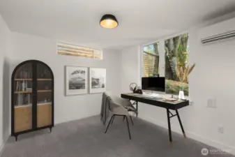 Lower-level bedroom offers privacy, comfort, and great natural light—ideal for guests, a home office, or flexible living.