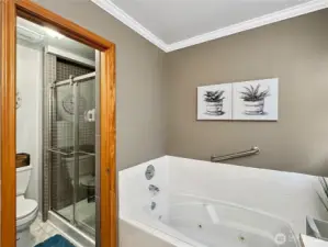 Updated stand up shower with tile and custom glass.