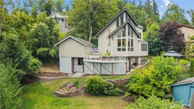 Lovely professionally planned backyard. Don't forget the covered golf driving room under the garage.