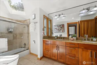 Enjoy the counter space and lovely wall mirror. Travertine Marble flooring throughout