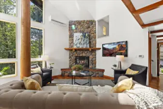 Vaulted ceilings, dramatic river rock fireplace. Enjoy Mother Nature front and center like your own wildlife movie. Great room concept for entertaining