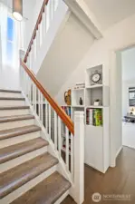 Staircase with built-ins to the side.