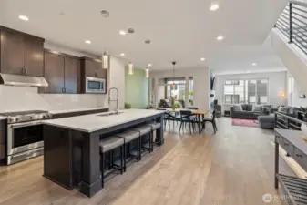 Bathed in natural light, the open floor plan provides an expansive & welcoming environment.