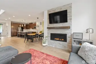Gather around the large gas fireplace in this inviting living room, perfect for cozy evenings.