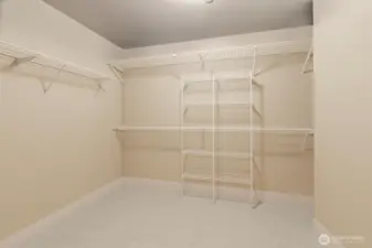 Any wardrobe will easily be accommodated in this oversized, walk in closet.