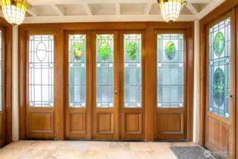 Sunroom off the kitchen has doors salvaged from a French hotel; this is a very cool feeling space.