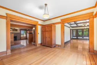 The parlor is a useful space between rooms, but this one is particularly wonderful with great light accenting the golden moulding. Notice from this room you can see both the formal living room and the informal family room which overlooks the gardens on the south side of the property.