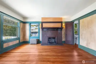 Primary bedroom spans two rooms on the 2nd floor; with a fireplace, attached 1/2 bath, and access to the roof deck, this is a lovely suite.