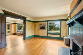 Primary bedroom spans two rooms on the 2nd floor; with a fireplace, attached 1/2 bath, and access to the roof deck, this is a lovely suite.