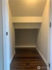 Storage under the stairs.