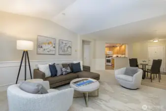 Living room features vaulted ceilings, gas-burning fireplace and access to the deck.