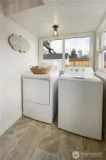 Charming laundry area with new flooring