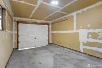 Both 2 bedroom units come with a garage, stylish mid-century fireplace & D/W.