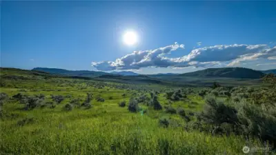 The Okanogan Valley at its finest. Looking north from the S-area, you get the absolute best vantage point of the valley's rolling hills and open sky. This isn't just a view; it's a lifestyle."
