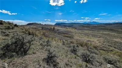 A great interior look from the center-east area. Looking south, you can see the easy transition from the higher ground to the expansive flat building sites. This orientation is perfect for planning a multi-structure homestead with prime southern exposure for solar or gardening.