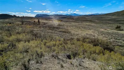 Unrivaled western vistas from the eastern high point. This elevated building site offers a 180-degree view of the valley below. Perfect for a home with floor-to-ceiling windows to capture the magical Okanogan sunsets and the changing seasons.