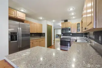 Kitchen has no shortage of counter-space. Also has a pantry seen here.