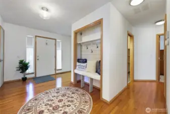 Bright and inviting main entrance welcomes you with an abundance of natural light. Step inside to stunning hardwood floors in a home that has been lovingly maintained.