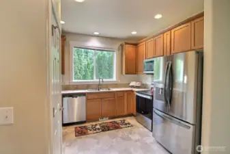Light and bright kitchen with stainless steel appliances. Brand new dishwasher!