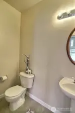 Simple elegance with the pedestal sink in the main floor powder room.
