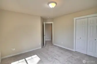 Another view of this front bedroom showing the entry and closet space.