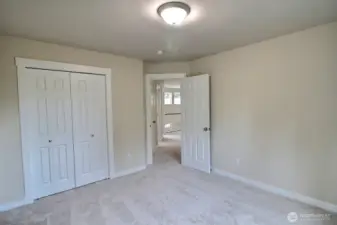 Another view from inside the back bedroom shows the closet and looks out the the landing.