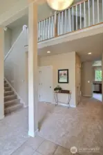 Step into the open, stylish feel of this home! Gorgeous railing, high ceilings, bright white trim, rounded corners and more!