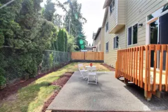 Large patio to sit and relax, enjoy the sun in this private back yard!